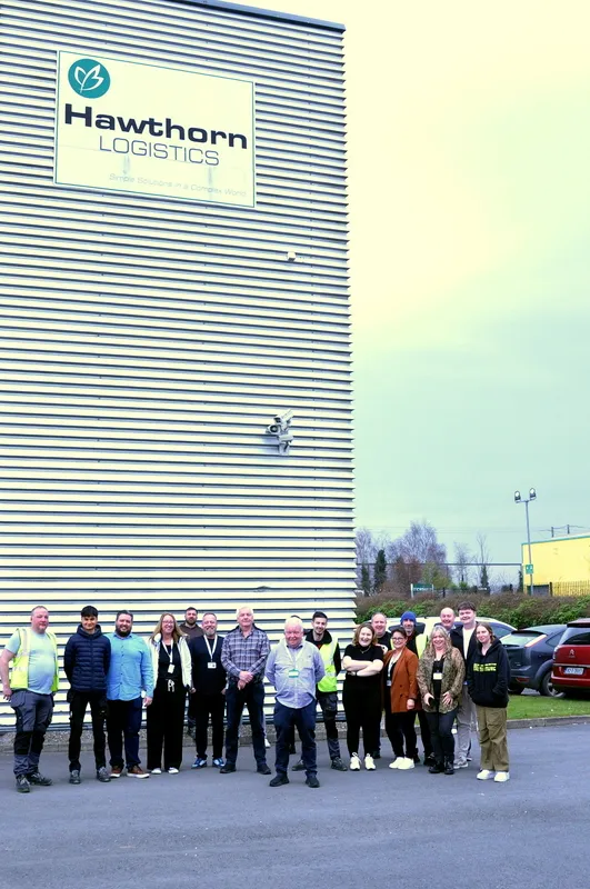 Hawthorn Logistics team outside the company building during the 18th birthday celebration